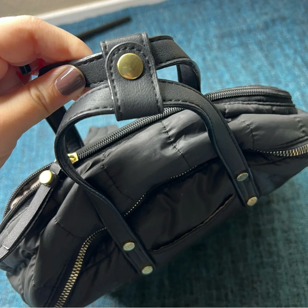 Tutilo Travel Backpack in Black with Gold Quilted Luggage Trolley Sleeve Pocket